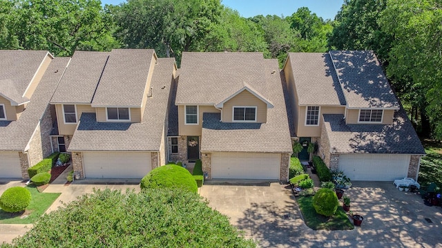 415 Oak Leaf Dr, Duncanville, TX 75137 - view of front of home featuring concrete driveway, stone siding, and a garage