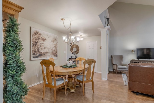 415 Oak Leaf Dr, Duncanville, TX 75137 - dining area with baseboards, a notable chandelier, and light wood-style floors
