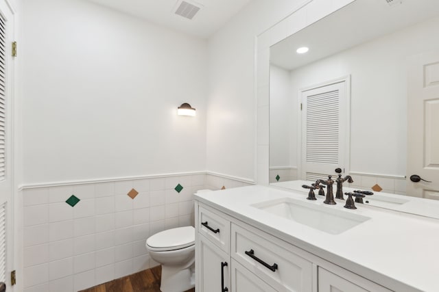 8 Estates Rd, Lucas, TX 75002 - bathroom featuring toilet, a wainscoted wall, vanity, tile walls, and recessed lighting