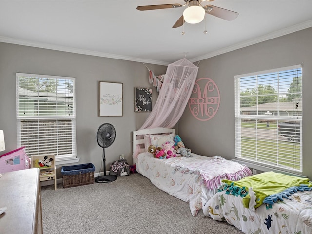 bedroom with crown molding, carpet floors, multiple windows, and ceiling fan