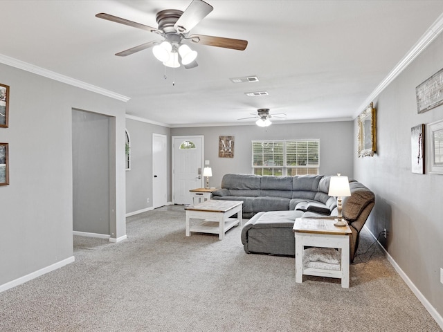 living area featuring crown molding, ceiling fan, baseboards, and carpet