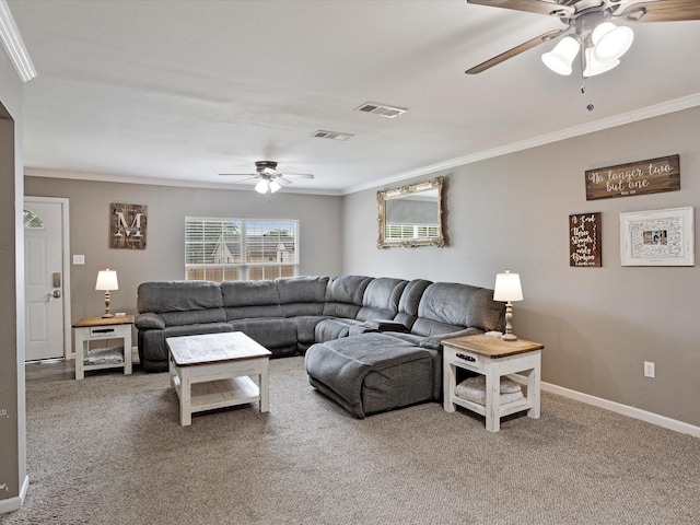 carpeted living room with ceiling fan, visible vents, ornamental molding, and baseboards