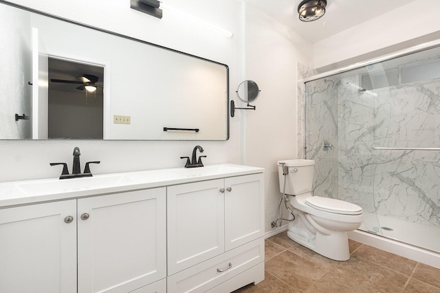 bathroom with a sink, a marble finish shower, and toilet