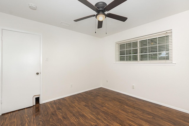 unfurnished room with baseboards, ceiling fan, and wood finished floors