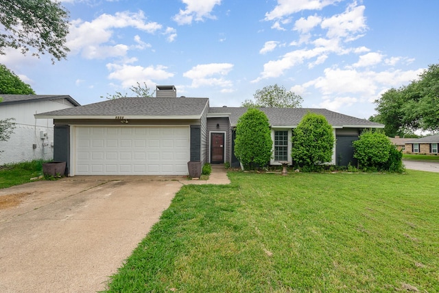 single story home with a chimney, a garage, a front yard, and concrete driveway
