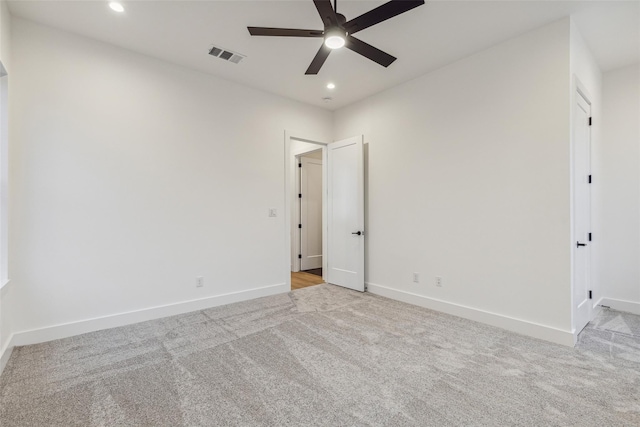 unfurnished bedroom featuring recessed lighting, baseboards, visible vents, and light carpet