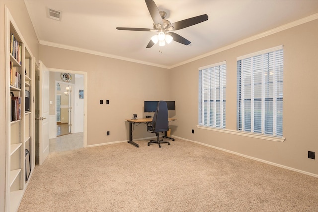 carpeted home office with a ceiling fan, baseboards, visible vents, and ornamental molding