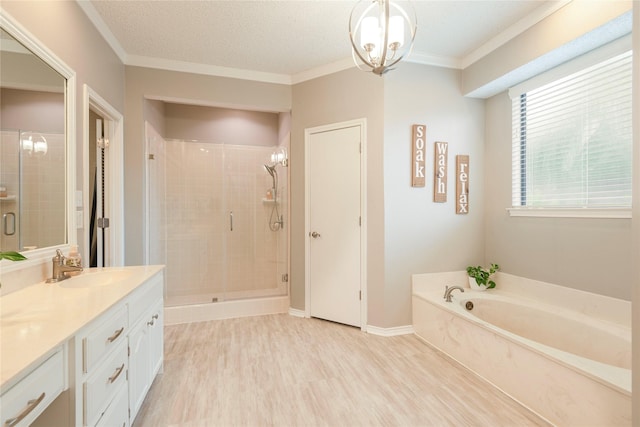 full bathroom with vanity, wood finished floors, a garden tub, and a stall shower