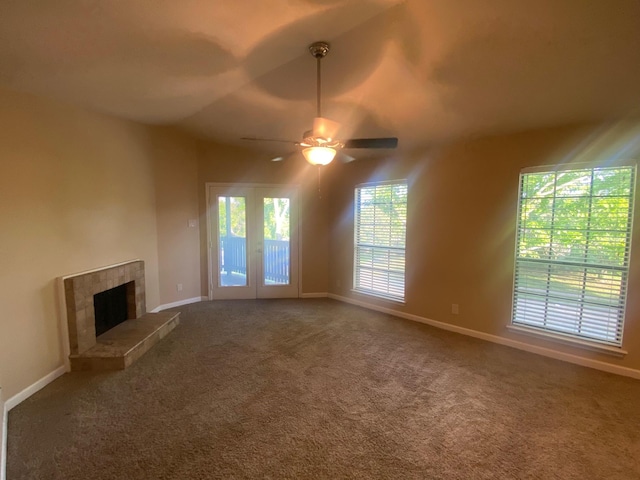3101 Townbluff Dr Unit 622, Plano, TX 75075 - unfurnished living room featuring a ceiling fan, baseboards, carpet, and a tile fireplace