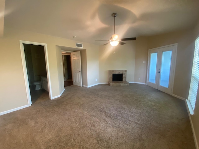 3101 Townbluff Dr Unit 622, Plano, TX 75075 - unfurnished living room featuring a ceiling fan, visible vents, carpet floors, baseboards, and a fireplace with raised hearth