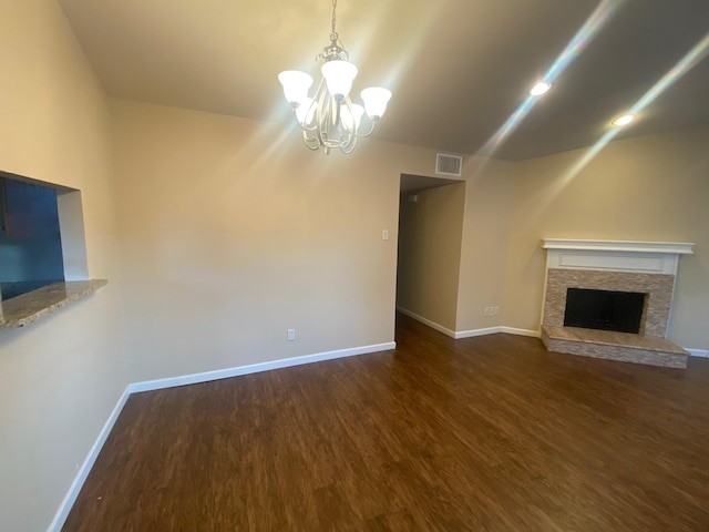 3101 Townbluff Dr Unit 622, Plano, TX 75075 - unfurnished living room with visible vents, a fireplace, wood finished floors, baseboards, and a chandelier