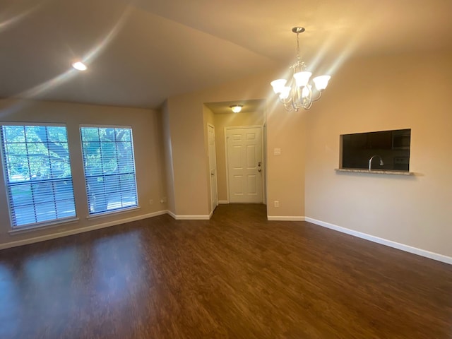 3101 Townbluff Dr Unit 622, Plano, TX 75075 - unfurnished living room with dark wood-type flooring, baseboards, a chandelier, and vaulted ceiling