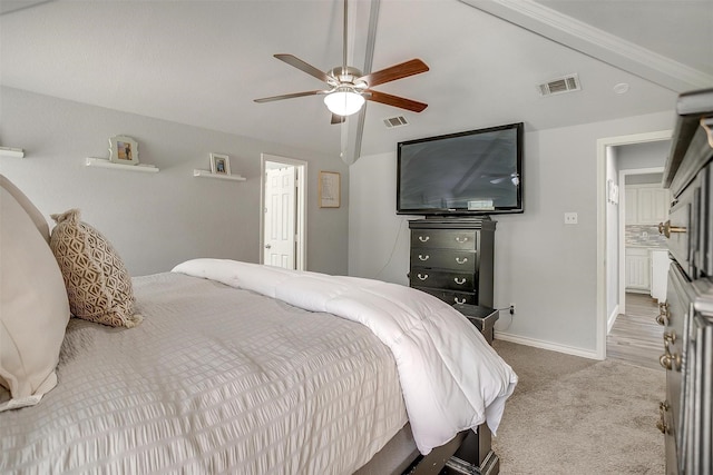 carpeted bedroom featuring baseboards, ceiling fan, lofted ceiling, and visible vents