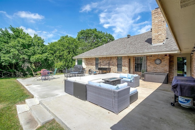 view of patio / terrace with an outdoor living space with a fire pit, outdoor dining area, and a grill