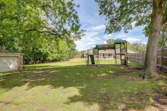 view of yard with a playground and fence