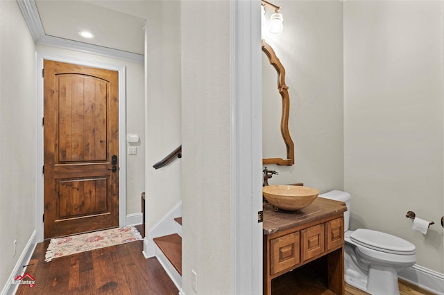 foyer featuring baseboards, recessed lighting, and dark wood-style flooring