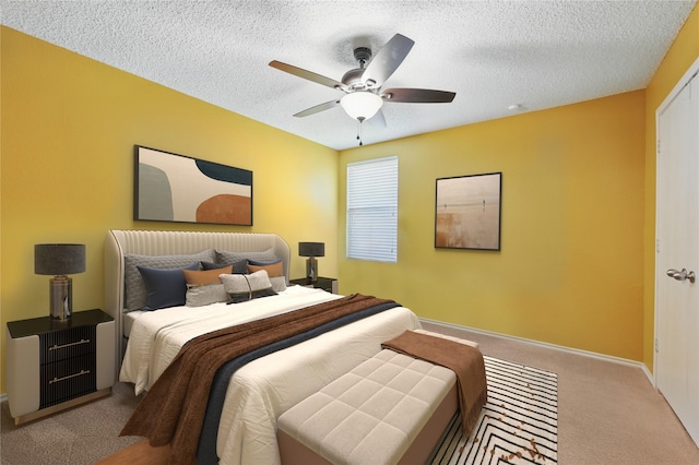 2011 Kalgary Ln, Grand Prairie, TX 75052 - carpeted bedroom with a textured ceiling, ceiling fan, and baseboards
