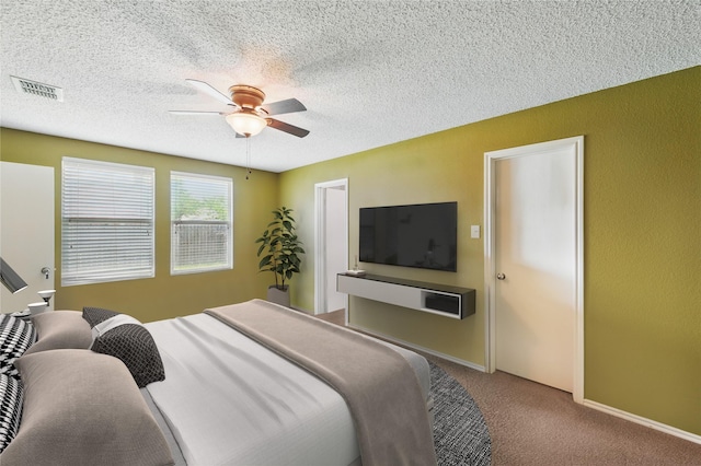 2011 Kalgary Ln, Grand Prairie, TX 75052 - carpeted bedroom featuring a textured ceiling and a ceiling fan