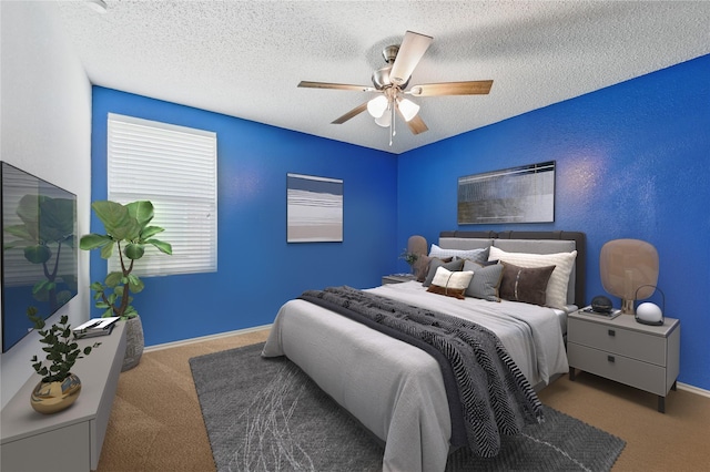 2011 Kalgary Ln, Grand Prairie, TX 75052 - bedroom with carpet, ceiling fan, a textured ceiling, and baseboards