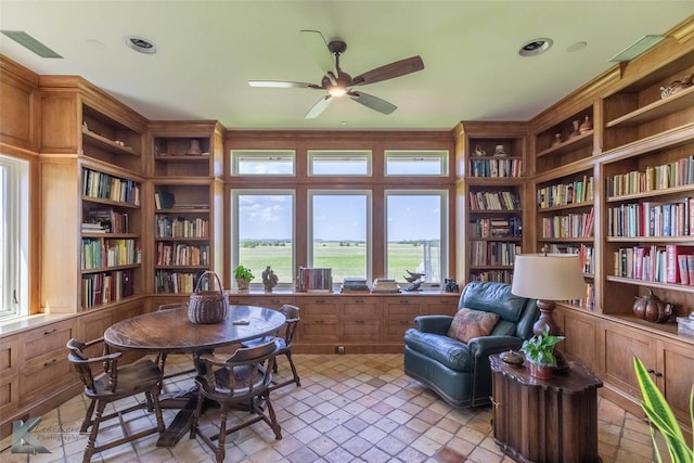 990 County Road 621, Tuscola, TX 79562 - living area with ceiling fan, bookshelves, built in shelves, and visible vents