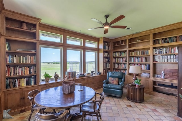 990 County Road 621, Tuscola, TX 79562 - living area featuring ceiling fan and bookshelves