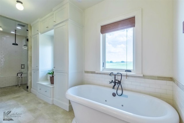 990 County Road 621, Tuscola, TX 79562 - bathroom featuring a freestanding tub and a shower stall