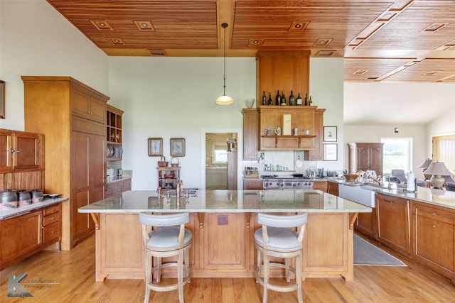 990 County Road 621, Tuscola, TX 79562 - kitchen featuring brown cabinetry, open shelves, and wooden ceiling