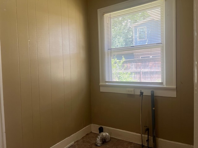 742 Elm St, Graham, TX 76450 - interior space with baseboards, wooden walls, and laundry area