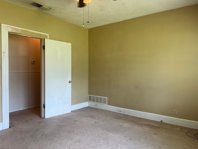 742 Elm St, Graham, TX 76450 - empty room featuring a textured ceiling, ceiling fan, visible vents, and carpet floors