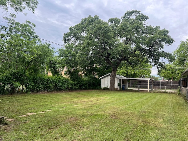 742 Elm St, Graham, TX 76450 - view of yard with fence and an outbuilding