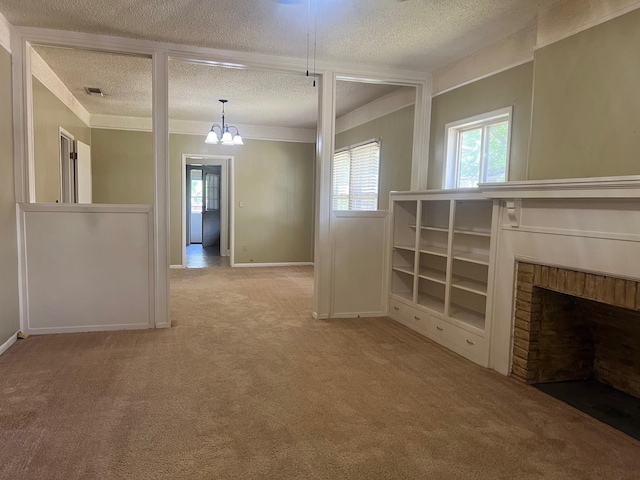 742 Elm St, Graham, TX 76450 - unfurnished living room featuring a textured ceiling, carpet flooring, visible vents, and a wealth of natural light