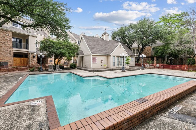 community pool with a patio
