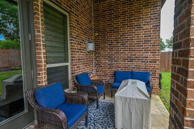 view of patio / terrace featuring fence and outdoor lounge area