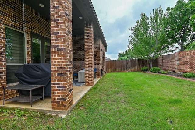 view of yard featuring cooling unit and a fenced backyard