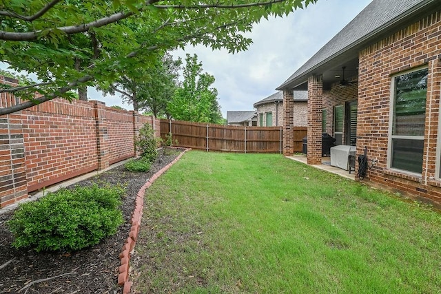 view of yard with a fenced backyard