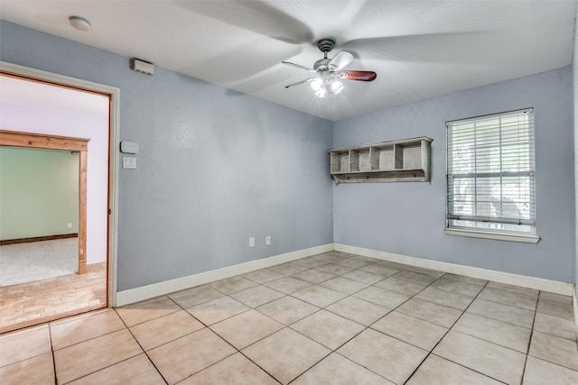 5313 Old Buena Vista Rd, Waxahachie, TX 75167 - spare room featuring light tile patterned floors, baseboards, and a ceiling fan