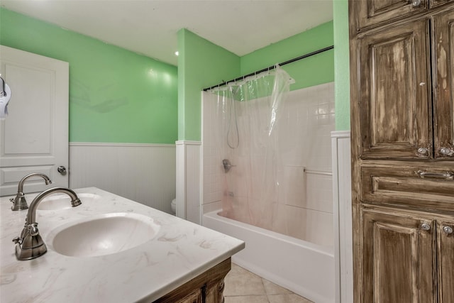 5313 Old Buena Vista Rd, Waxahachie, TX 75167 - bathroom with vanity, tile patterned floors, a wainscoted wall, and shower / bath combination with curtain