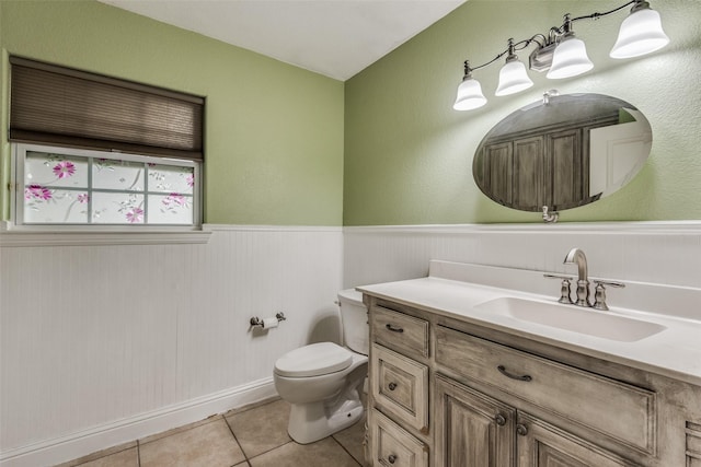 5313 Old Buena Vista Rd, Waxahachie, TX 75167 - bathroom with toilet, tile patterned floors, wainscoting, and vanity
