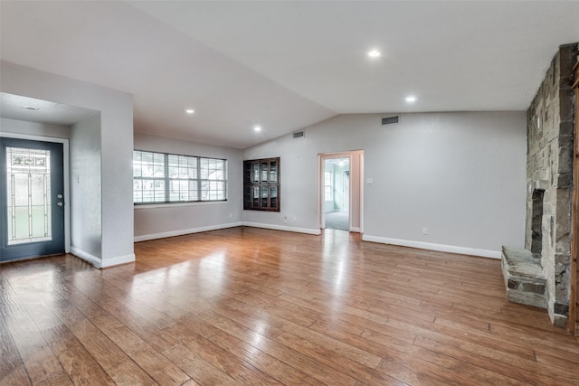 5313 Old Buena Vista Rd, Waxahachie, TX 75167 - unfurnished living room featuring visible vents, light wood finished floors, a healthy amount of sunlight, and vaulted ceiling