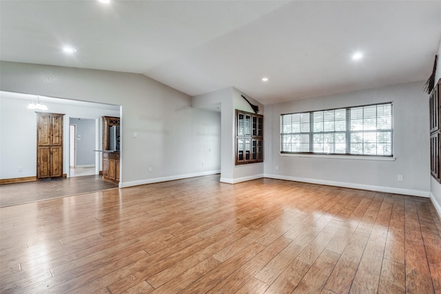 5313 Old Buena Vista Rd, Waxahachie, TX 75167 - unfurnished living room featuring baseboards, recessed lighting, wood finished floors, and vaulted ceiling