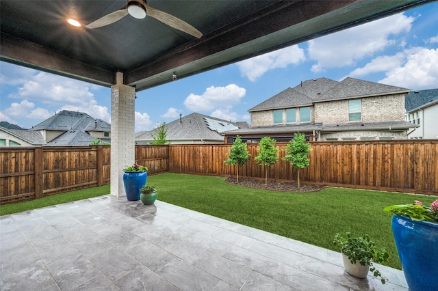 view of patio featuring a ceiling fan and a fenced backyard