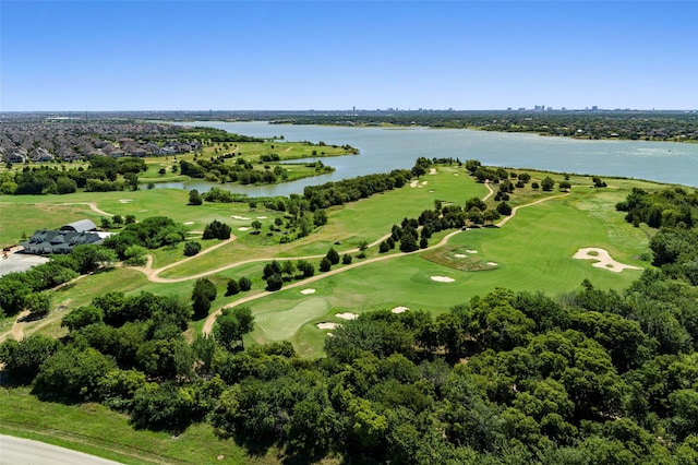 bird's eye view with a water view and golf course view
