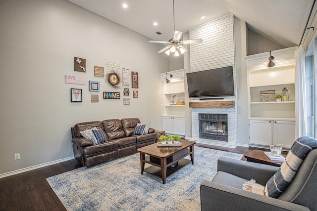 living area featuring ceiling fan, a brick fireplace, recessed lighting, baseboards, and hardwood / wood-style flooring