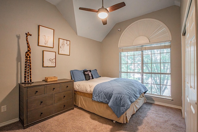 bedroom with baseboards, ceiling fan, lofted ceiling, and light carpet