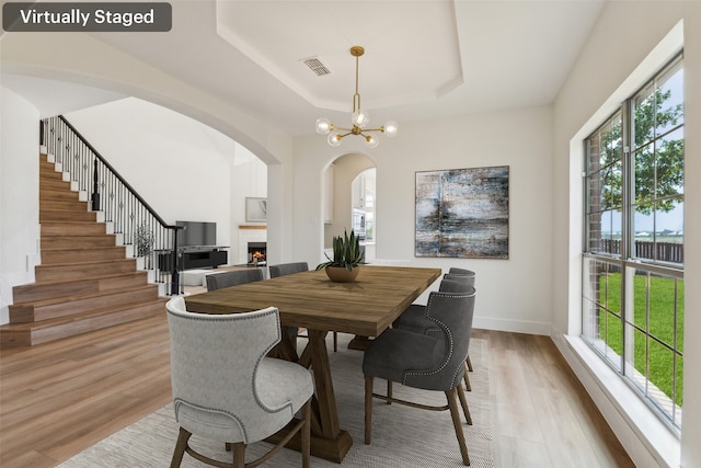 kitchen featuring decorative backsplash, under cabinet range hood, a healthy amount of sunlight, and stainless steel appliances