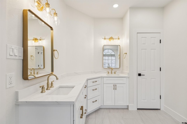 full bathroom with double vanity, a sink, marble finish floor, and recessed lighting