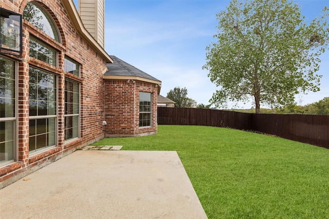 view of yard featuring a fenced backyard and a patio area