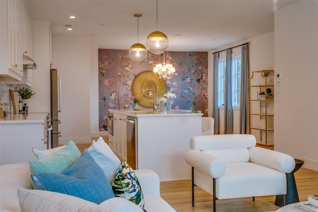 interior space featuring light wood-type flooring, baseboards, wallpapered walls, an inviting chandelier, and recessed lighting