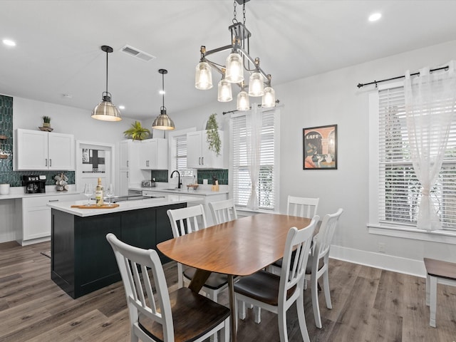 dining area featuring visible vents, recessed lighting, baseboards, and wood finished floors
