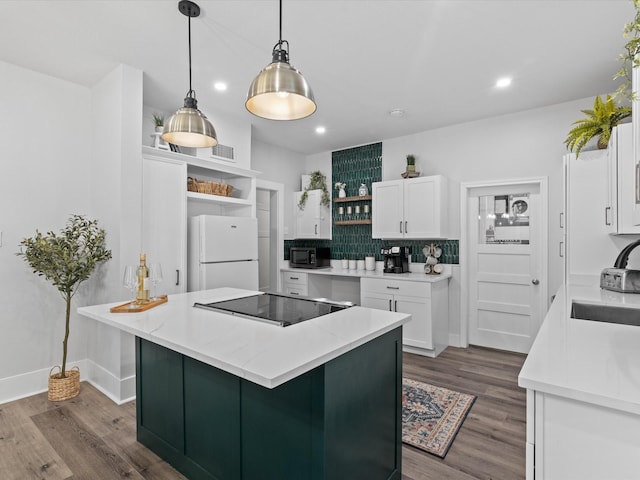 kitchen featuring white cabinets, open shelves, a sink, dark wood-style floors, and black appliances